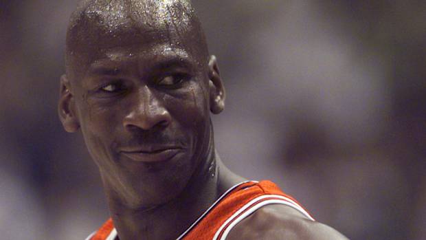 Michael Jordan smiles during a game.